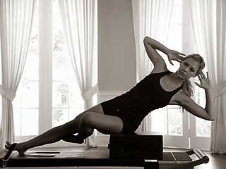Pilates pose on the side on a reformer